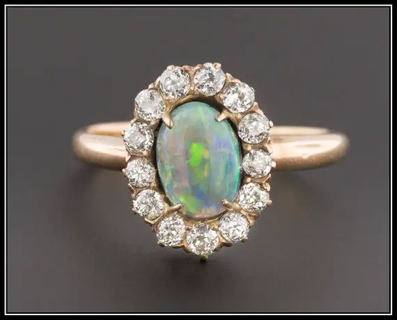 Halo Setting Opal Ring from Trademark Antiques on Etsy