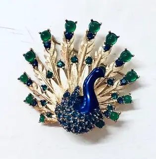 Vintage Boucher Peacock Pin from Shop Goods Vintage on Etsy