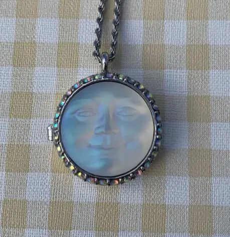 Iridescent Kirks Folly Moon Necklace from JellicleCatTreasures on Etsy