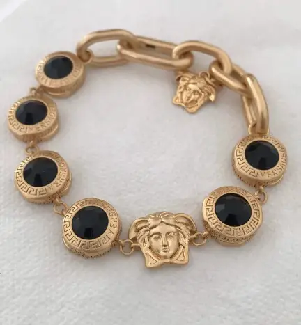 Gold Plated VERSACE Medusa Heads Charm Bracelet from CandysgemsShop on Etsy